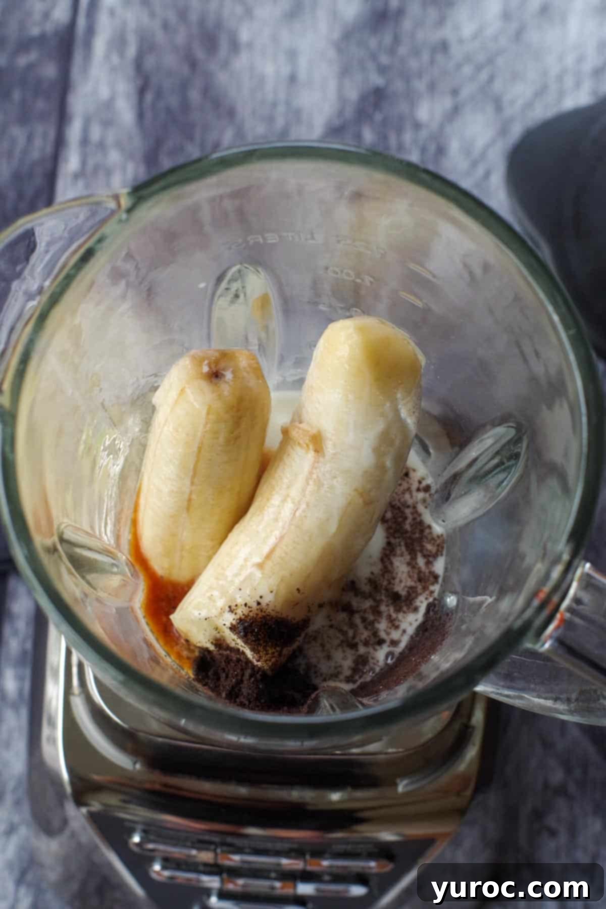 Guilt-Free Oreo Banana Milkshake 4 All the measured ingredients for the Oreo banana milkshake placed inside a blender jar, ready for blending.