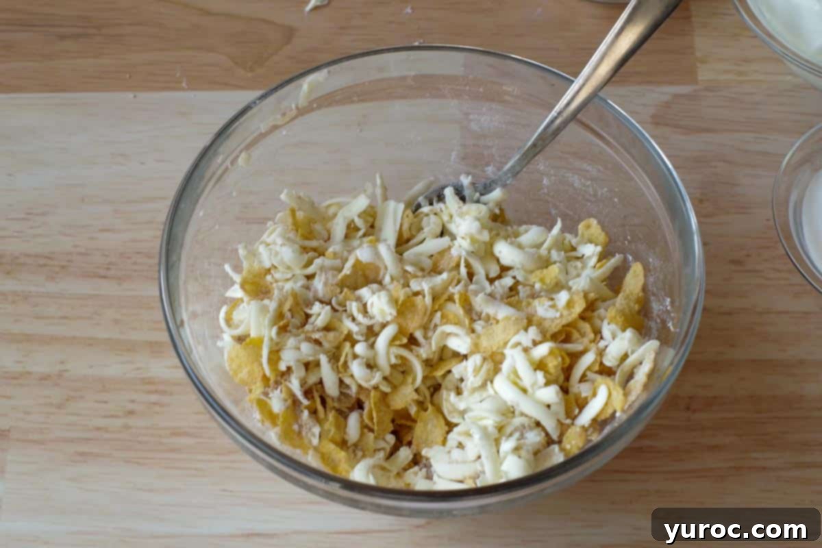The cornflake, brown sugar, flour, and butter mixture combined to form a coarse crumb topping.