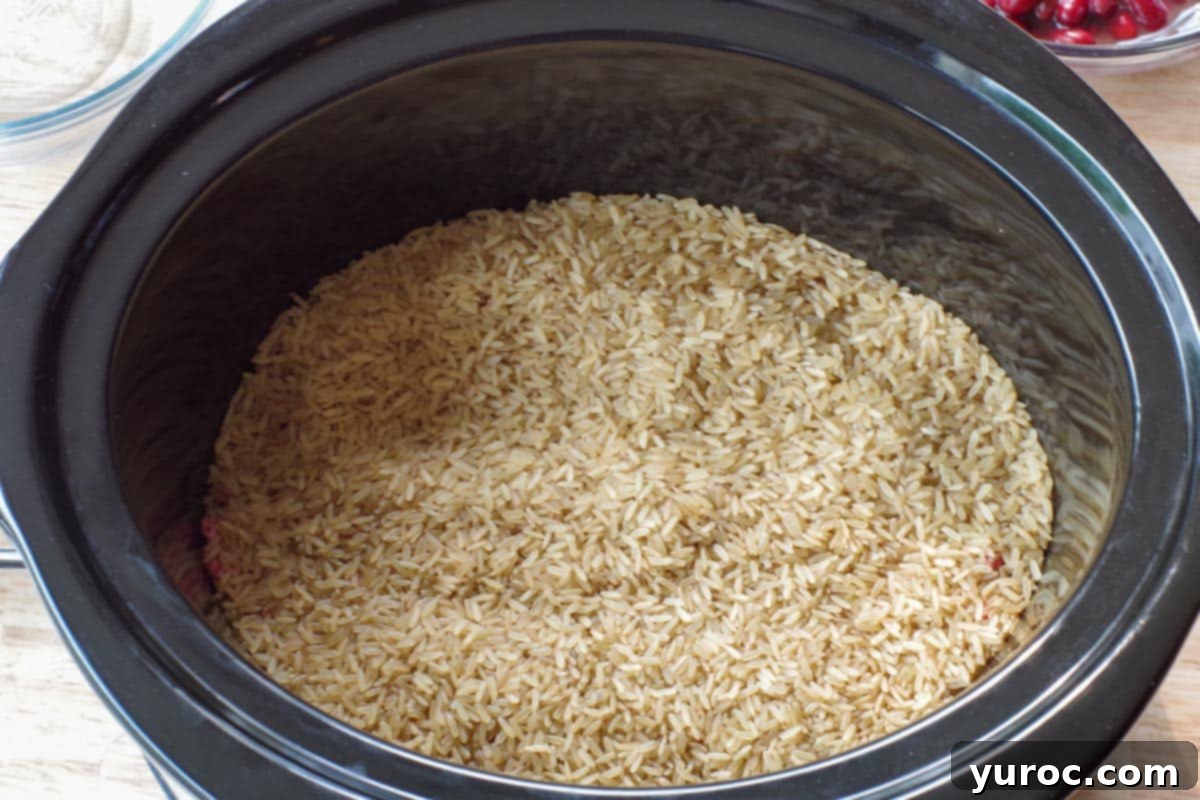 rice on top of ground beef in crock pot