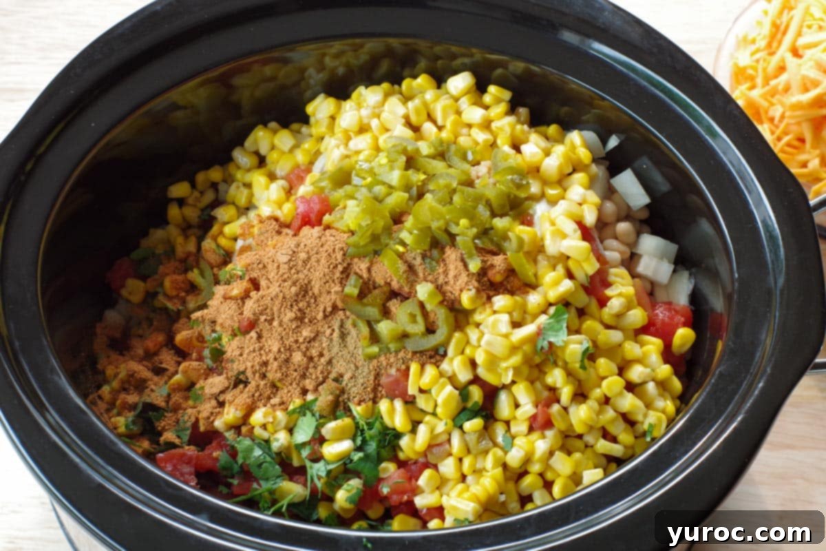all other ingredients (except cheese) added to crockpot, on top of rice and ground beef