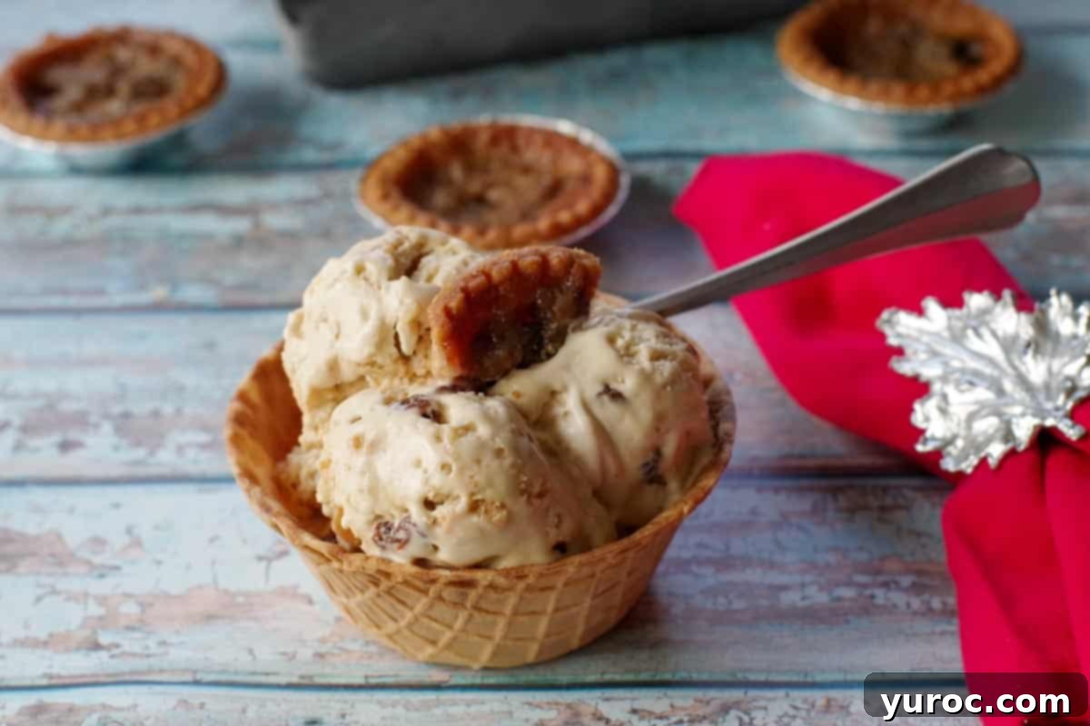 Effortless Butter Tart Dream Ice Cream 17 A scoop of butter tart ice cream served in a crisp waffle bowl, with a festive red napkin on the side.