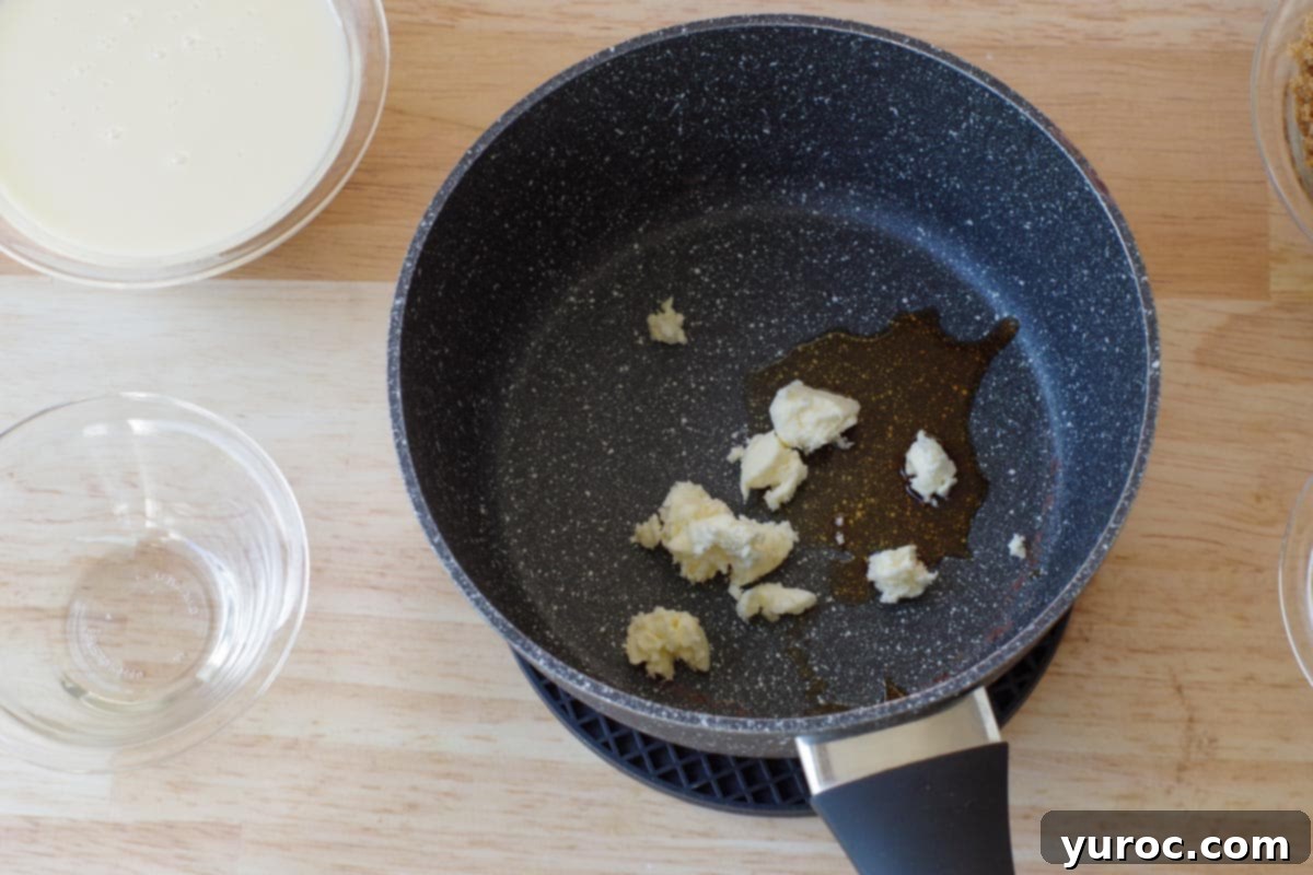 Effortless Butter Tart Dream Ice Cream 3 Unsalted butter and vanilla extract melting in a small saucepan over low heat.