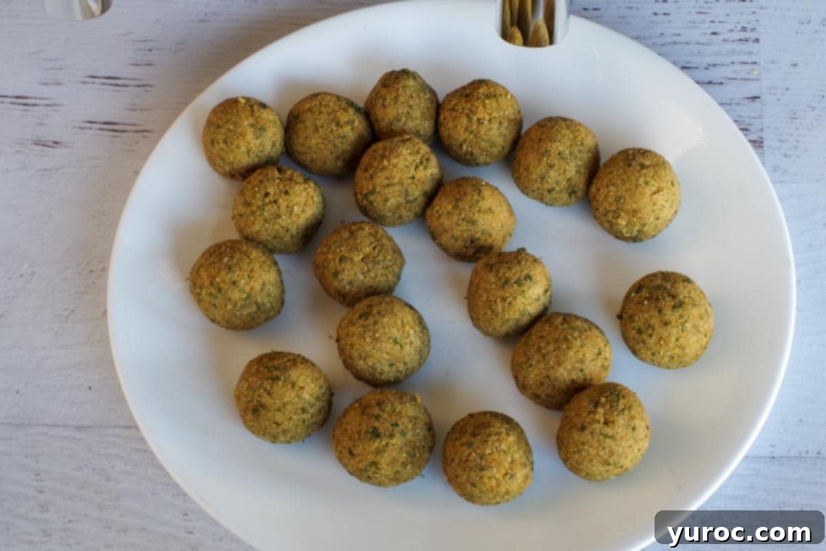 Crispy Air Fryer Falafel from Mix 6 falafel mix formed into balls on white plate