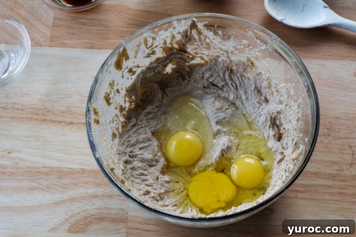 Grab-and-Go Cereal Cookies for School 5 eggs added to creamed butter and sugar in glass bowl
