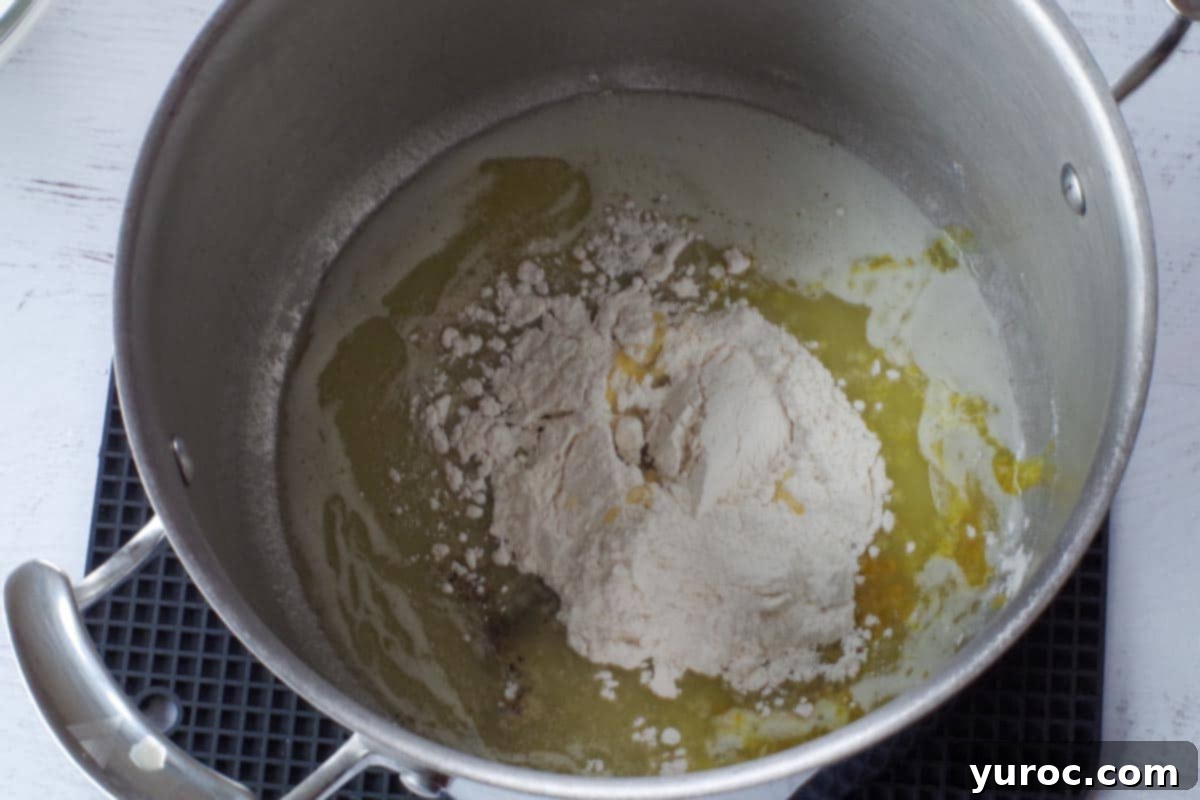 Silky Light Chicken Fettuccine 5 Flour, salt, pepper, and chicken bouillon added to melted butter in a pot.