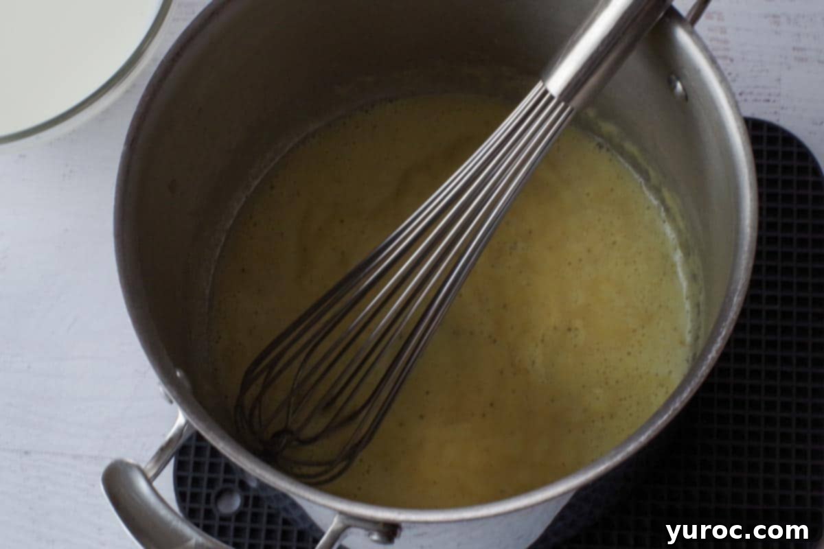 Silky Light Chicken Fettuccine 6 Whisking flour, bouillon, salt, and pepper into melted butter.