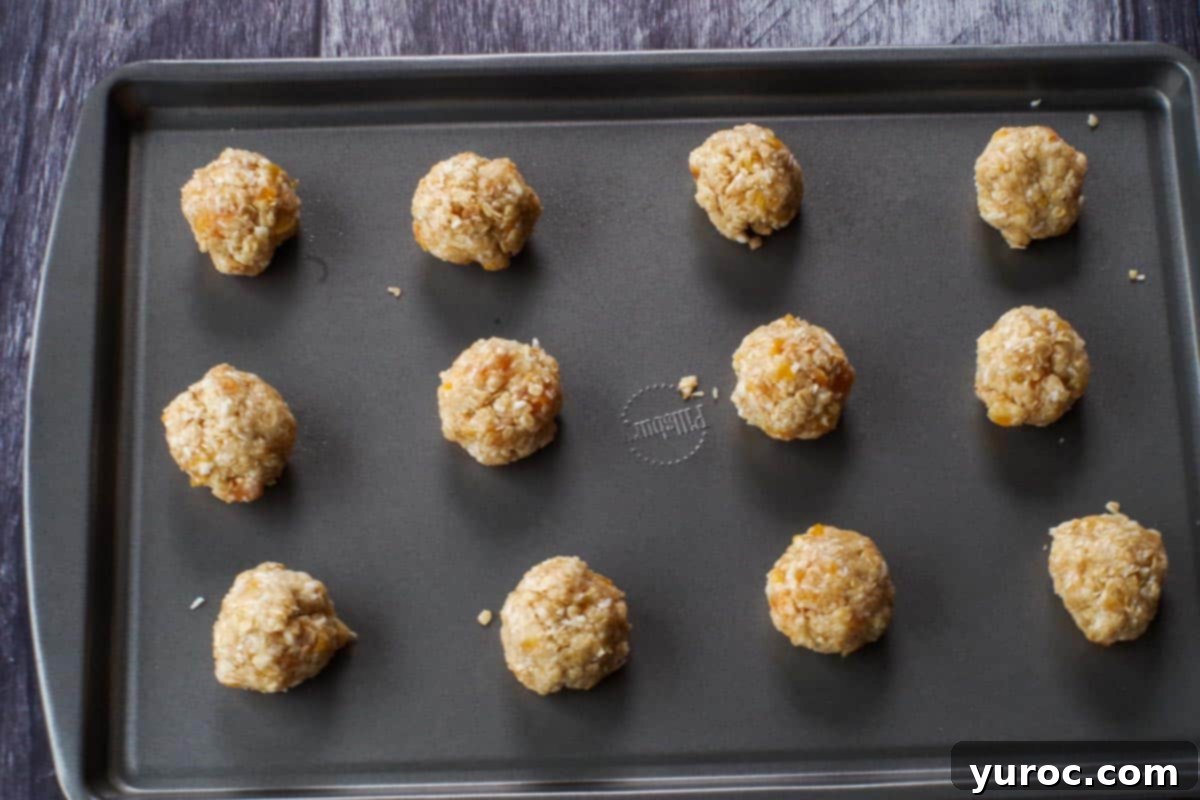Cookie dough rolled into uniform balls and arranged on an ungreased baking sheet, spaced for baking