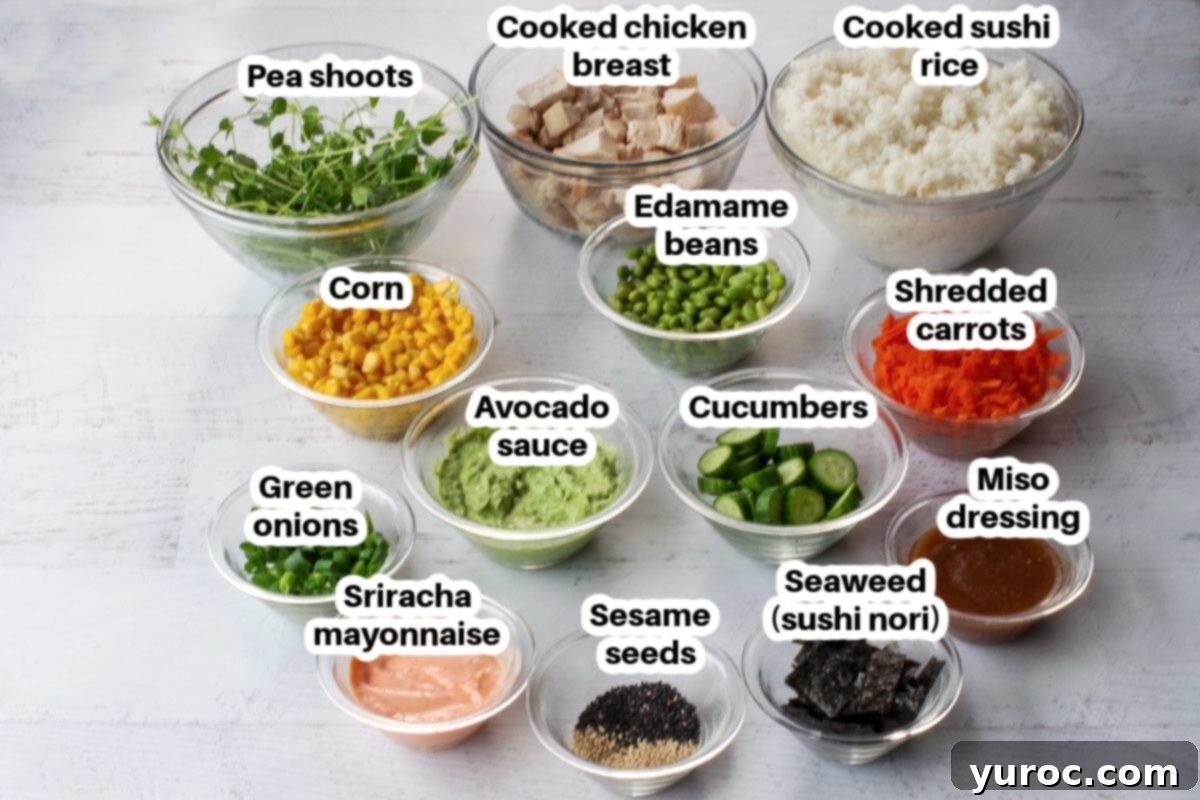 Individual ingredients for chicken poke bowls, neatly separated into glass bowls and clearly labeled.