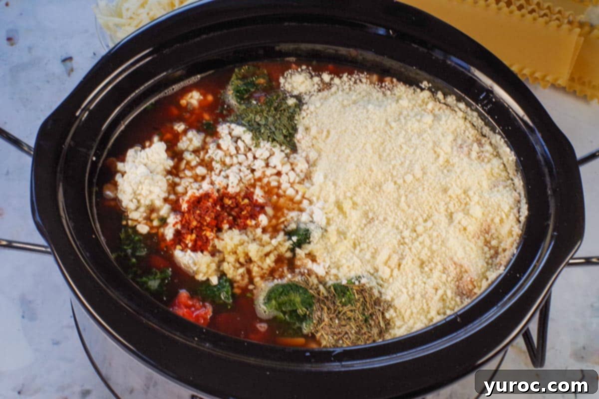 All ingredients (except mozzarella and lasagna noodles) added to a slow cooker