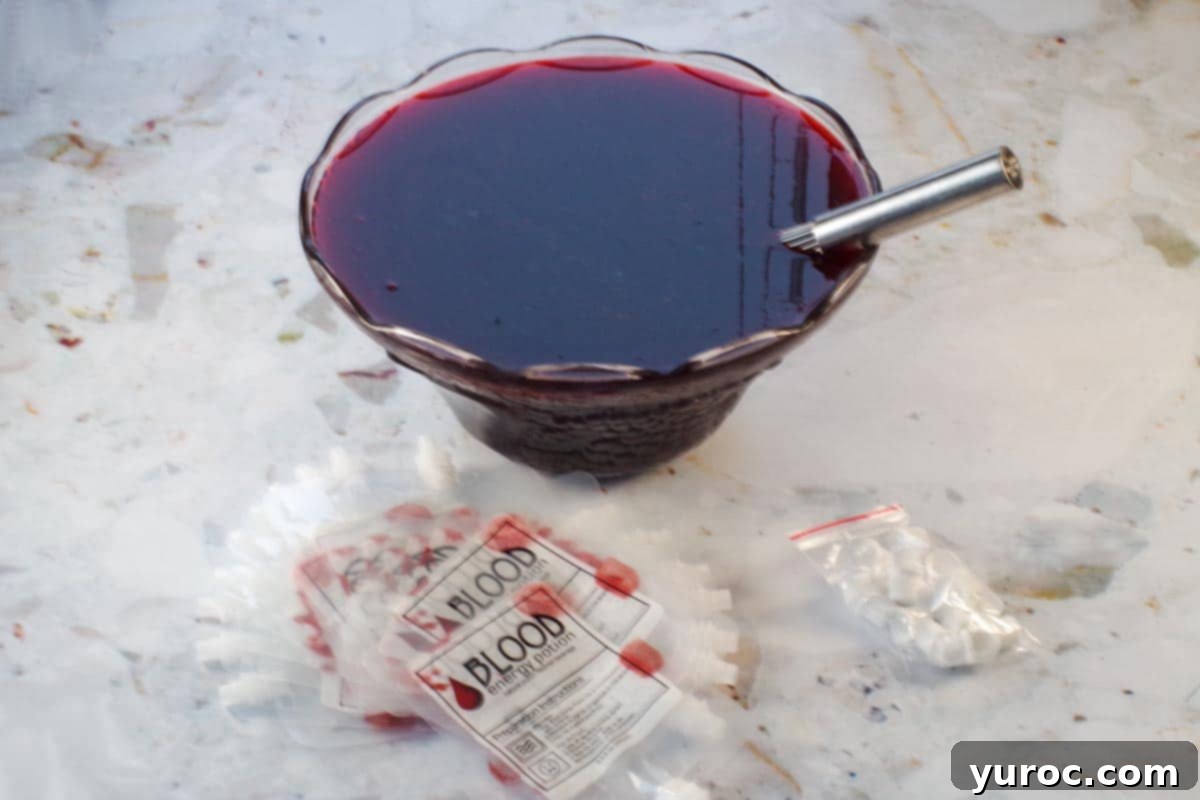 Virgin Blood Bags Halloween 3 All punch ingredients, including juices and sparkling water, mixed together in a large punch bowl.