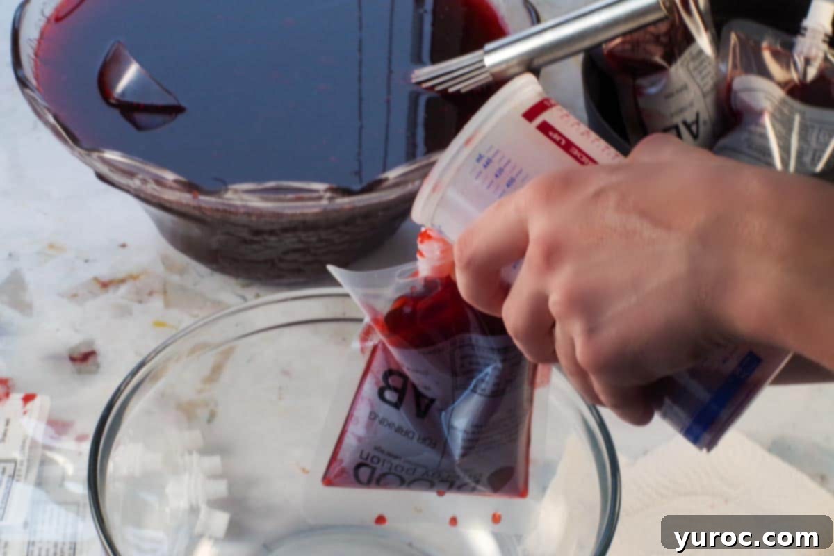 Virgin Blood Bags Halloween 6 A Halloween blood bag being filled to the brim with the festive punch, showing it almost ready for sealing.