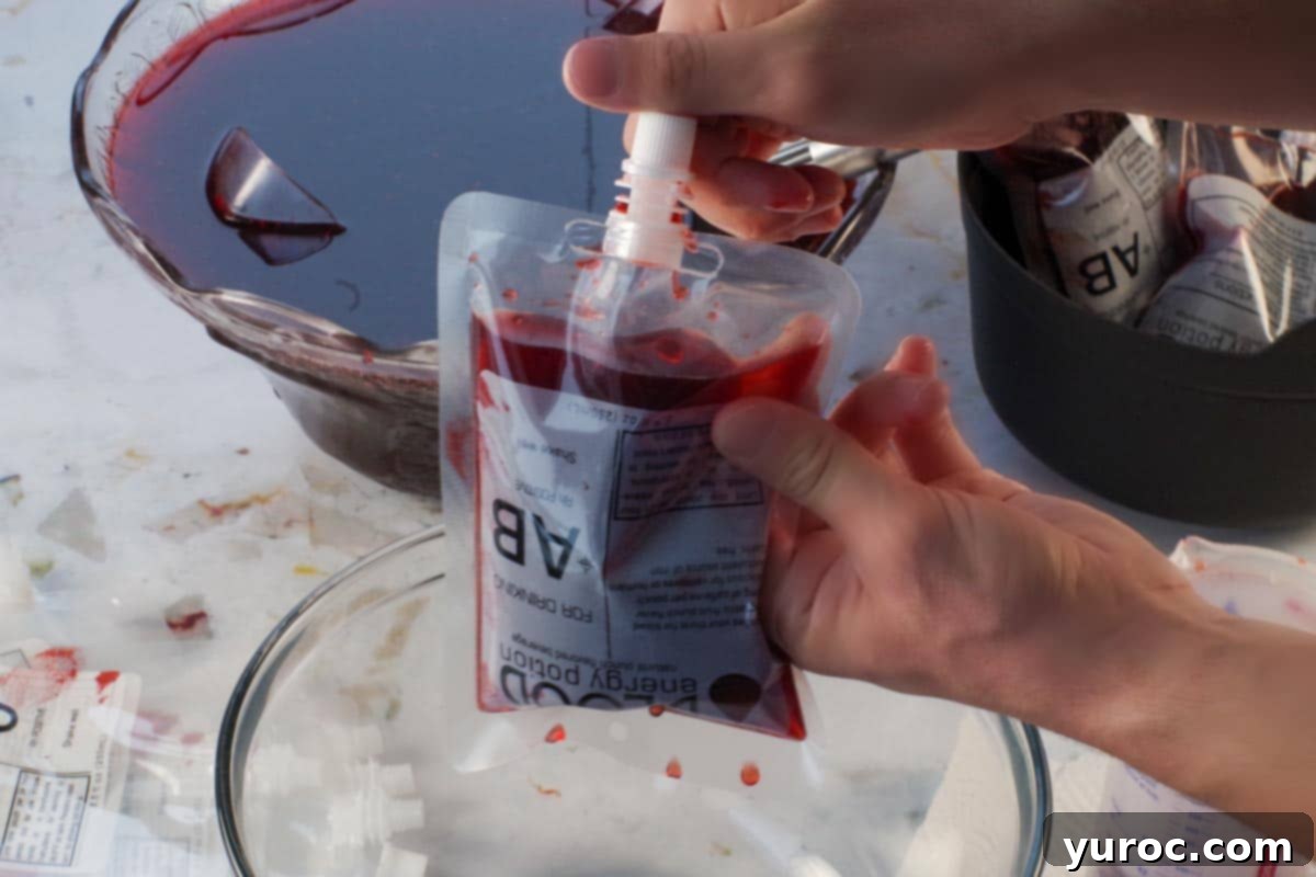 Virgin Blood Bags Halloween 7 The lid being securely placed back onto a filled Halloween blood bag, sealing the spooky drink.