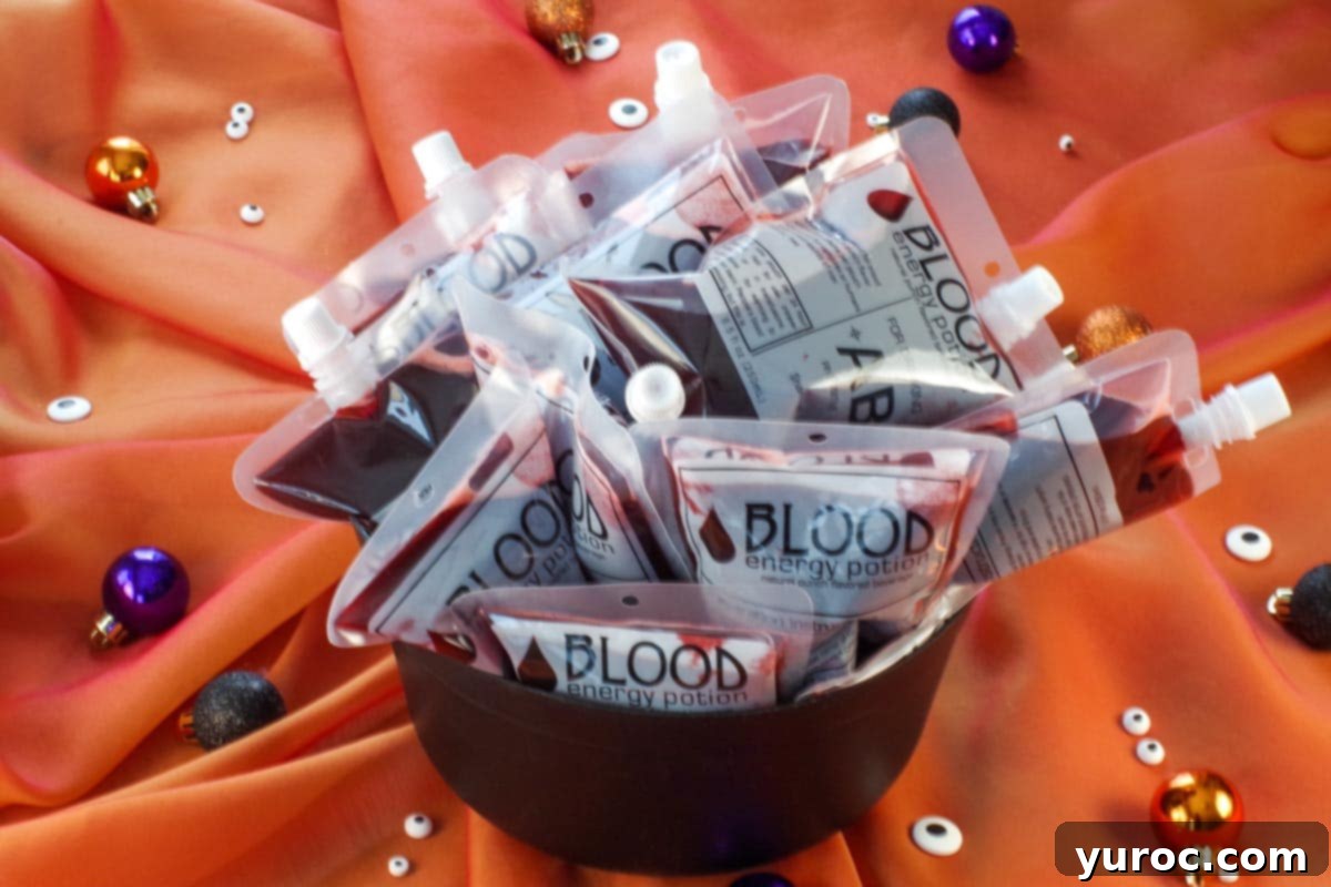 Virgin Blood Bags Halloween 8 Multiple Halloween blood bags ready for serving, arranged attractively in a dark cauldron.