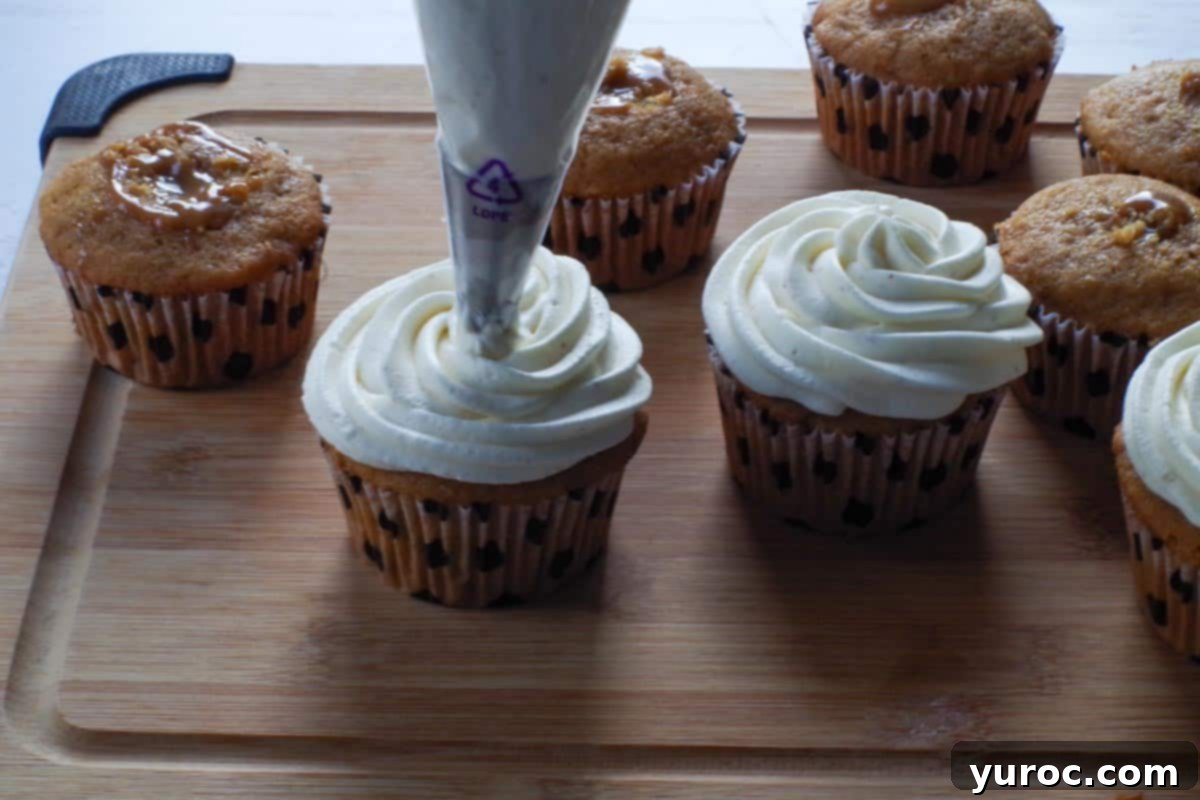 Cupcakes being frosted with a 1M piping tip