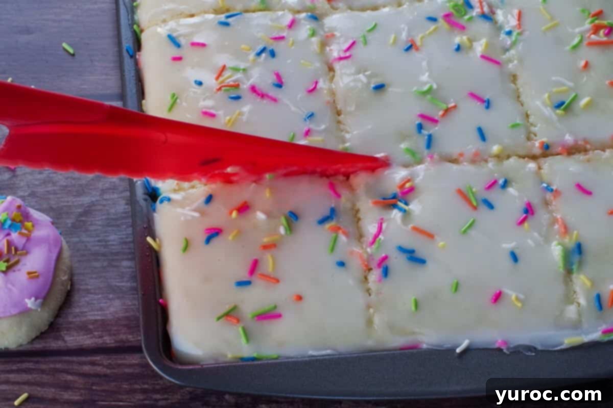 sugar cookie sheet pan pancakes being cut into 12 pieces