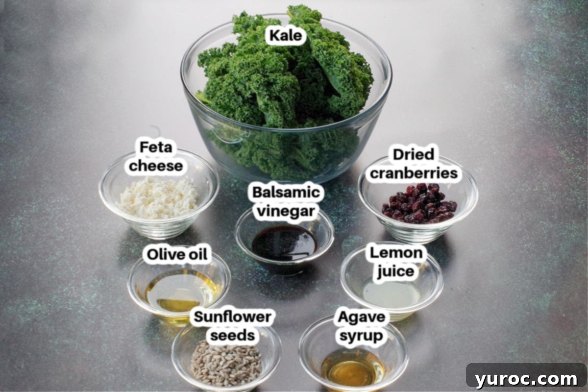ingredients in kale cranberry feta salad in glass bowls, labelled
