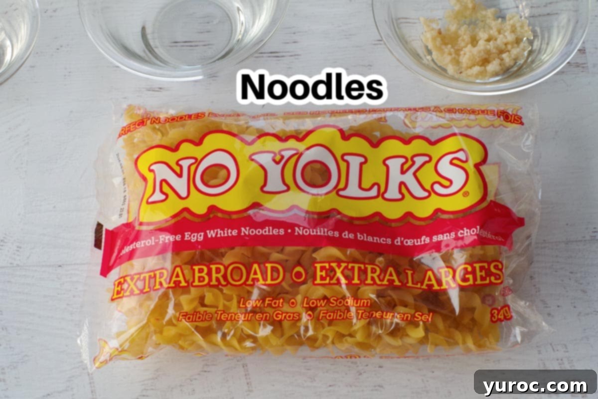package of egg noodles (no yolks) with some glass bowls with ingredients in background
