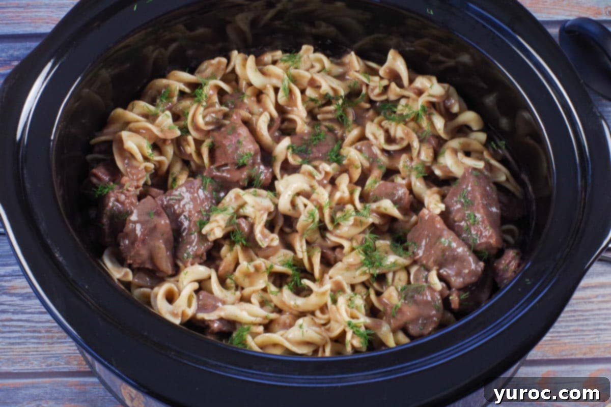 beef stroganoff, with noodles added, in slow cooker