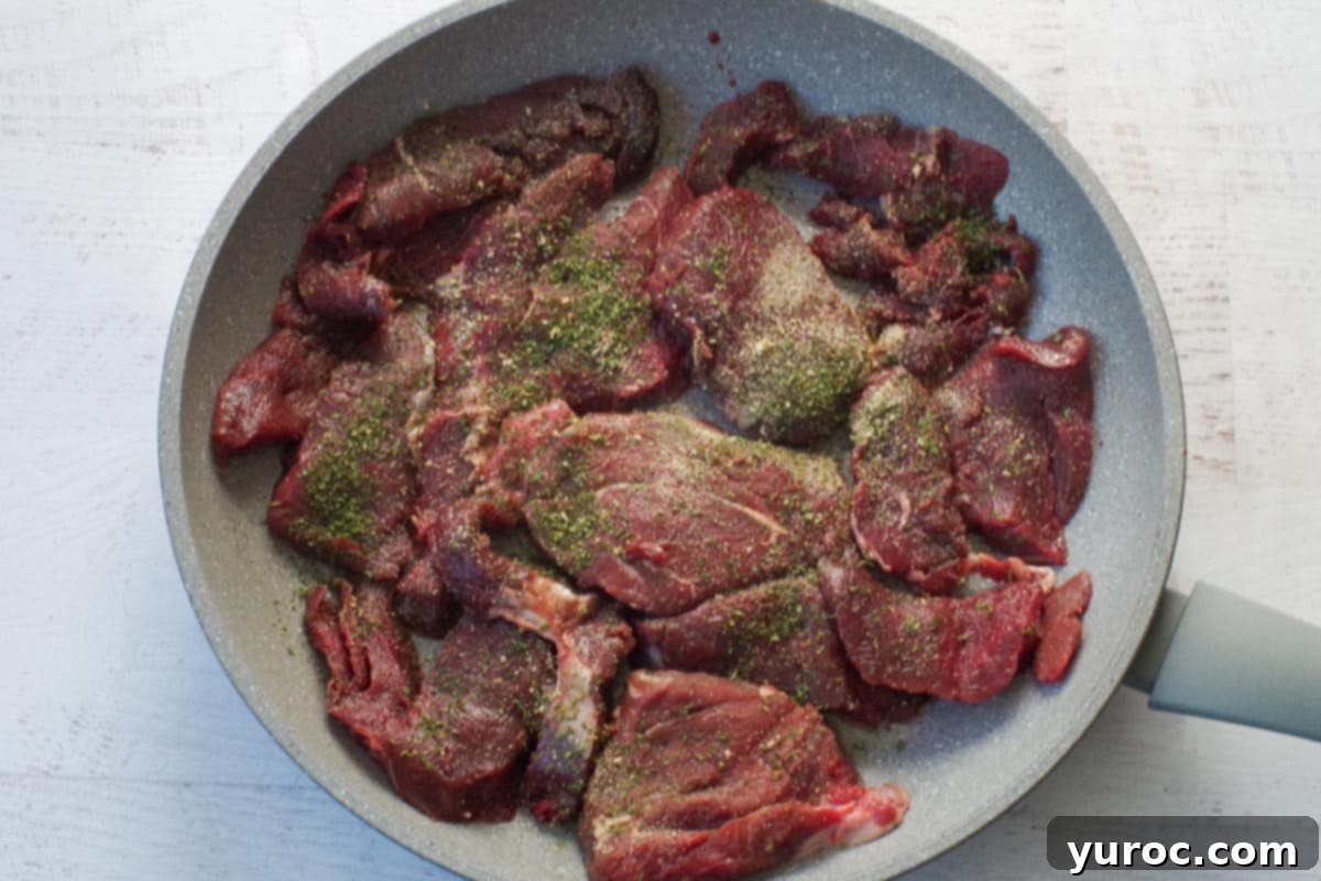 meat added to skillet and sprinkled with remaining parsley and garlic powder for first side