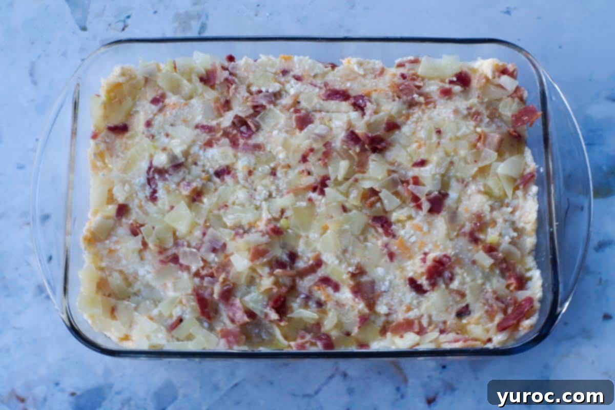 Easy Weeknight Pierogi Casserole 12 repeat - 2 more layer of noodles, potato mixture and onion butter and bacon mixture added on top of first layer in glass pan