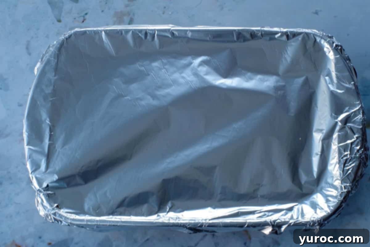 Easy Weeknight Pierogi Casserole 14 glass 9x13 dish sealed with aluminum foil