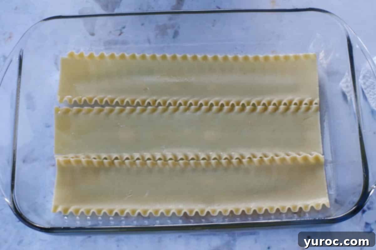 Easy Weeknight Pierogi Casserole 9 3 lasagna noodles on the bottom of a 9x13 glass pan