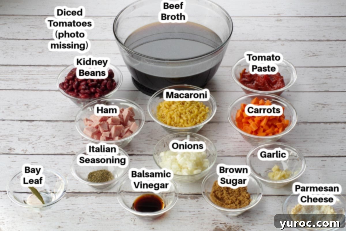 Hearty Ham and Macaroni Soup 3 Collection of fresh and pantry ingredients for ham macaroni soup, neatly arranged in small glass bowls, each clearly labeled for easy identification.