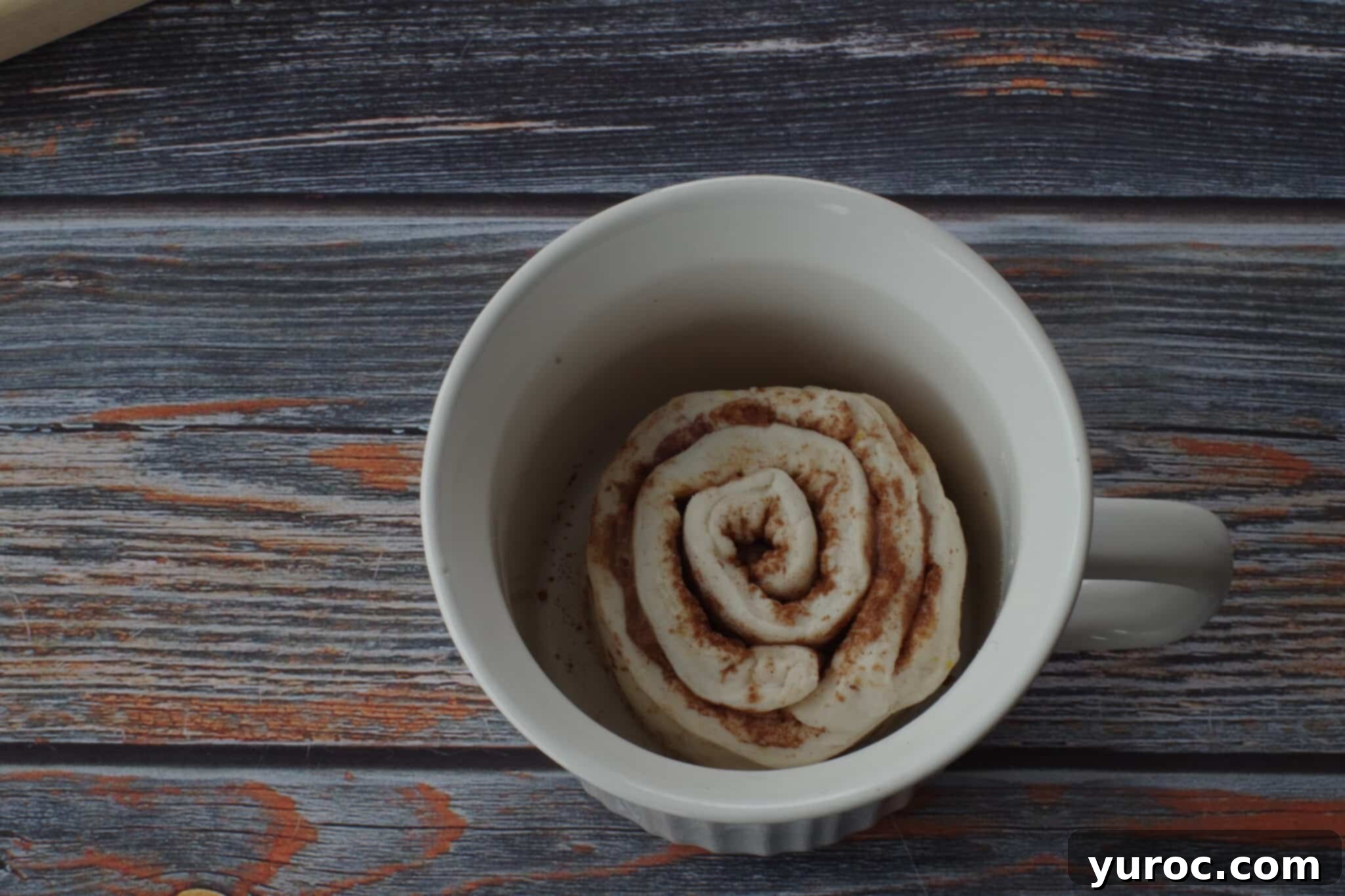 Healthy Cinnamon Swirl Mug Treat 15 cinnamon roll dough placed inside a meal mug