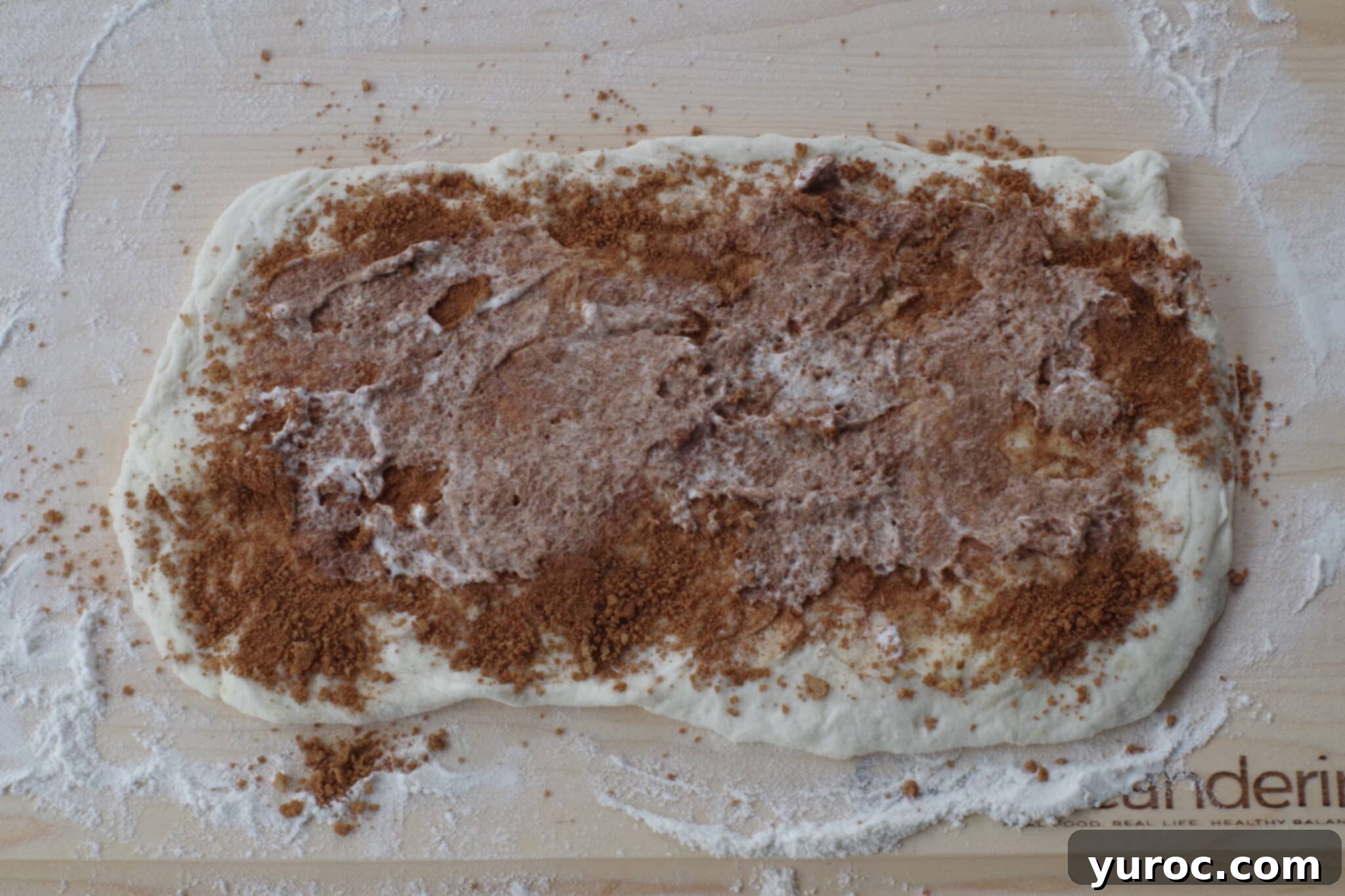 Healthy Cinnamon Swirl Mug Treat 9 whipped cream spread on brown sugar cinnamon mixture on dough rectangle