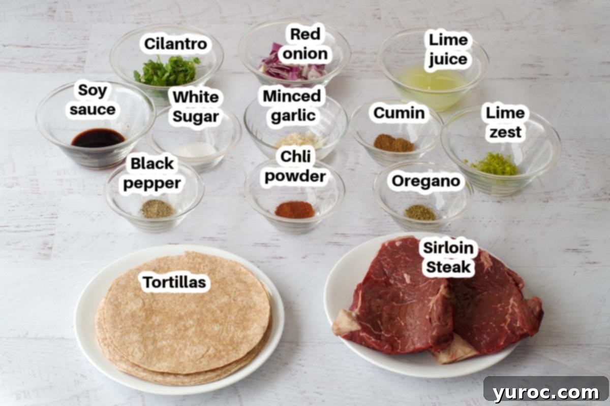 air fryer steak tacos in glass bowl on white faux wooden surface