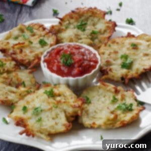 shredded air fryer potato pancakes on a white plate with a white bowl of salsa in the middle
