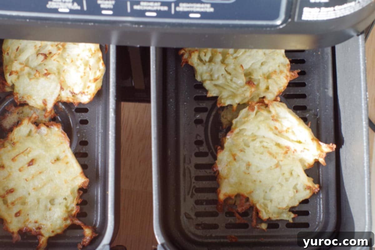 Air fryer potato pancakes flipped over in drawer