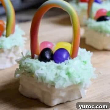 A charming Mini Easter basket cake rests on a wooden surface, with more festive mini Easter basket cakes gracefully arranged in the background.