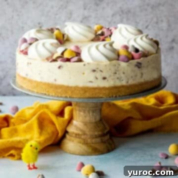 A delightful Mini Egg cheesecake arranged on a rustic wooden cake stand, accented by a soft yellow linen and whimsical Easter decorations.