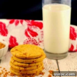 Gourmet Butterscotch Toffee Cookies 8 stack of butterscotch toffee cookies with a glass of milk and red and white tea towel in the background