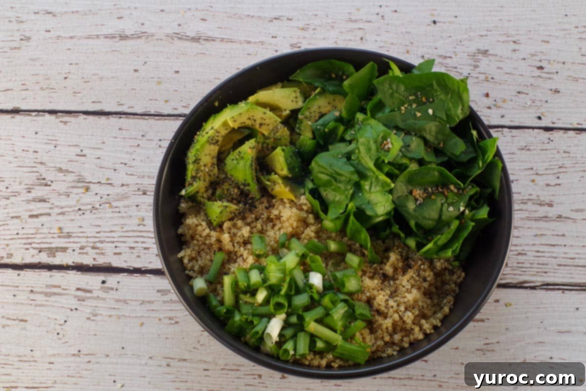Avocado Breakfast Power Bowl 7 avocado spinach, green onion and quinoa sprinkled with Everything Bagel seasoning