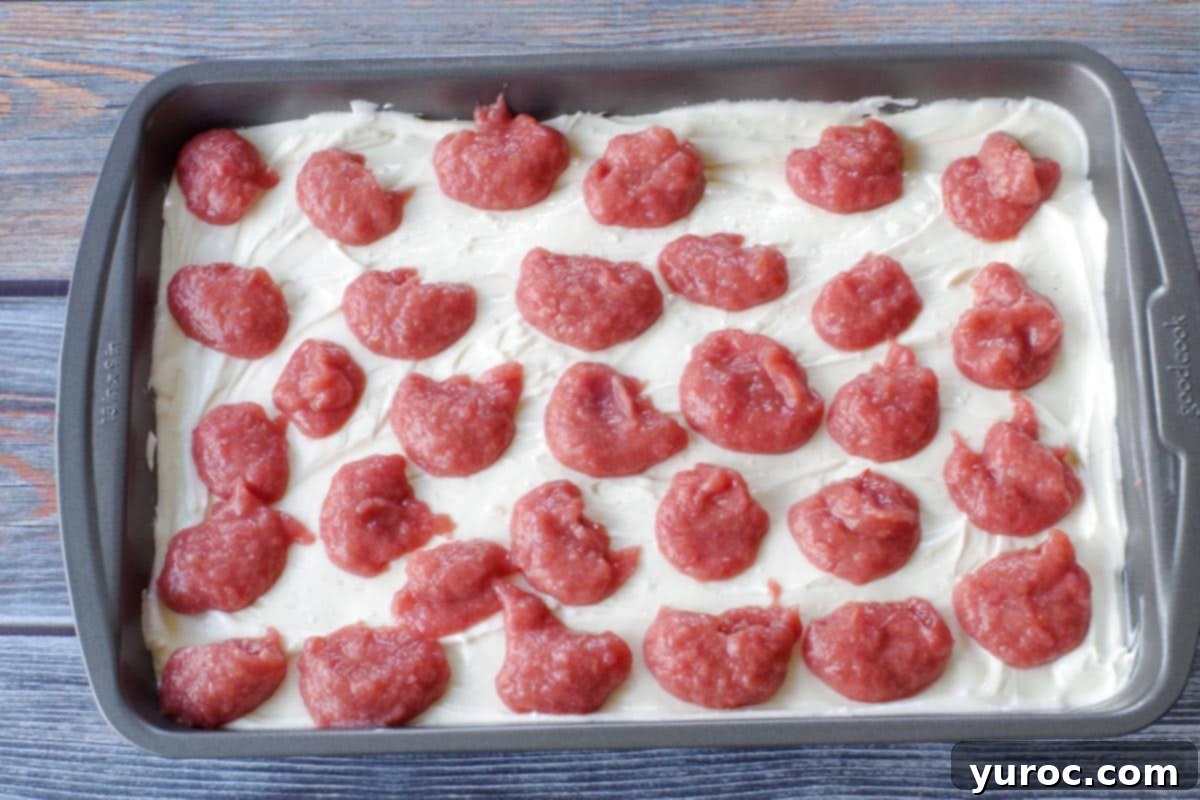 rhubarb puree dollops dropped onto cream cheese mixture
