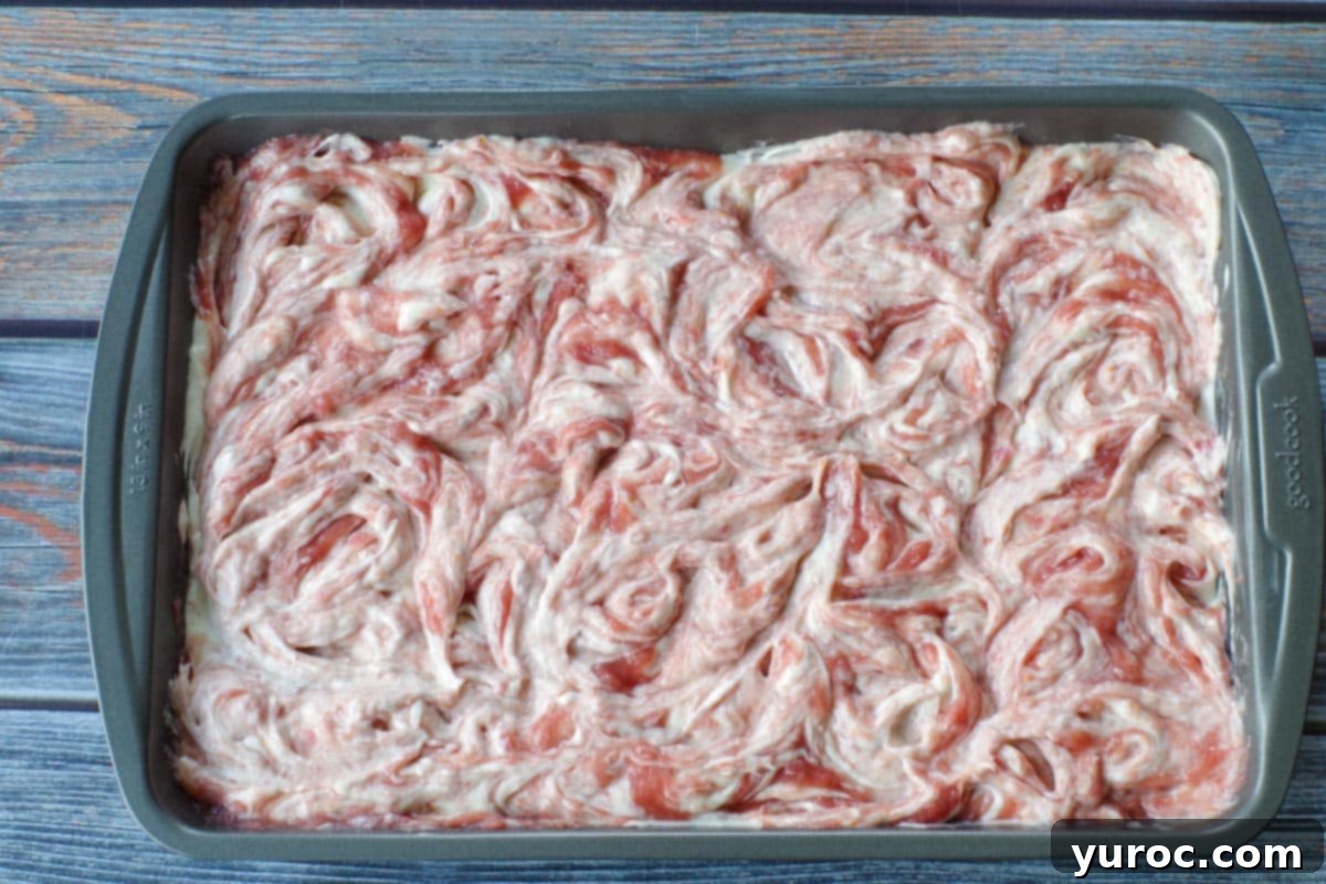 pan of rhubarb bars with swirled top