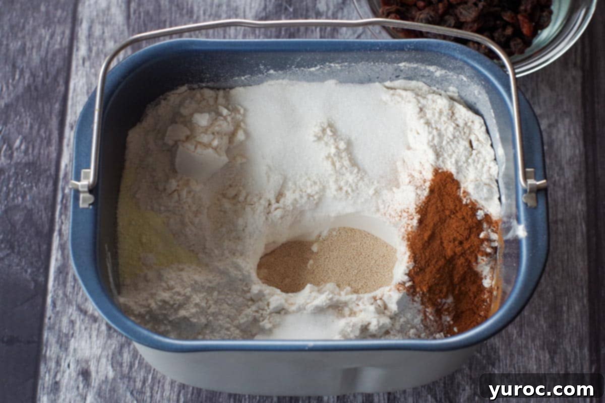 yeast measured and poured into a well in the flour
