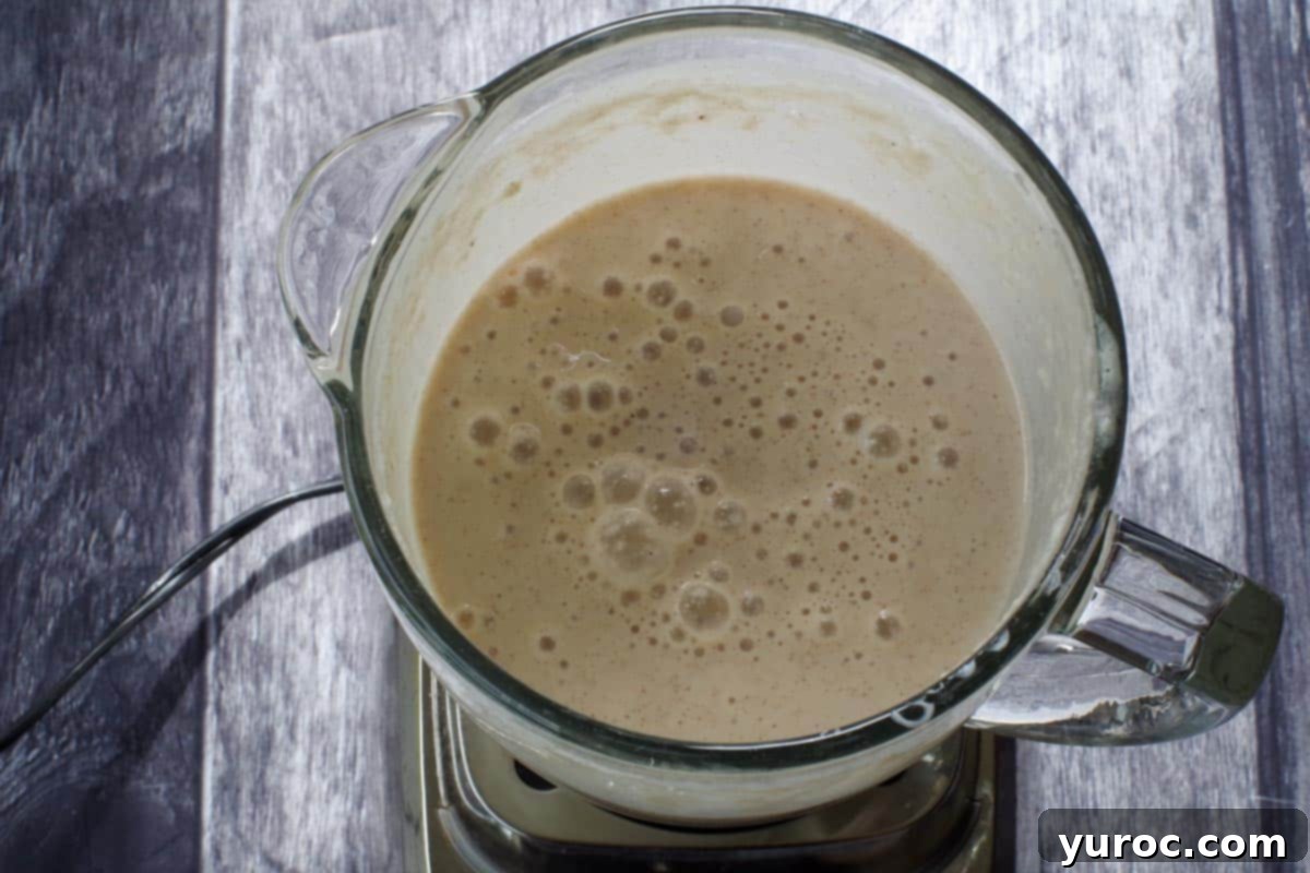 Wholesome Apple Pie Spice Blend 7 Smoothie ingredients fully blended into a smooth, creamy consistency, ready to be poured.