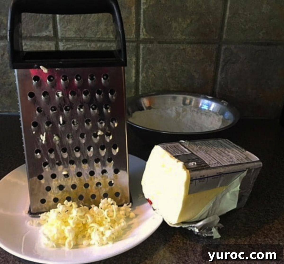Saskatoon Berry Bliss Bars 15 butter being cut (for pastry) with a cheese grater