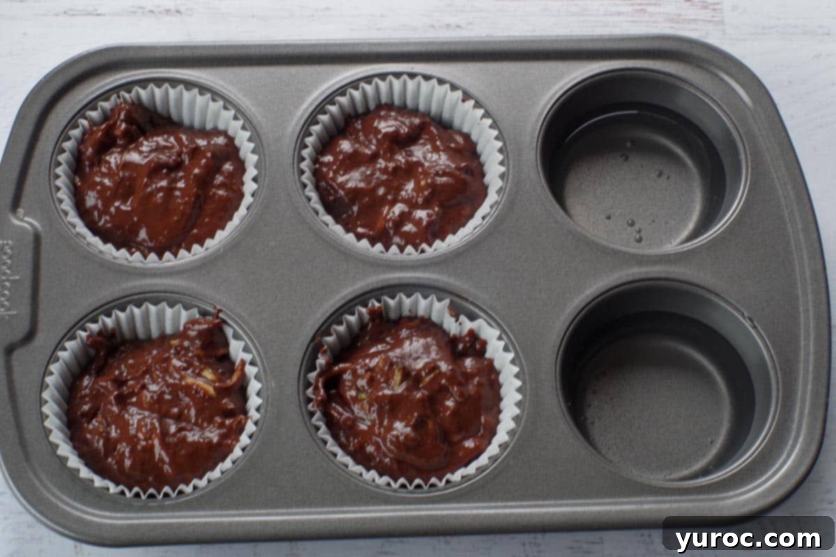 Empty muffin tins filled with water for even baking on a 6-muffin tin