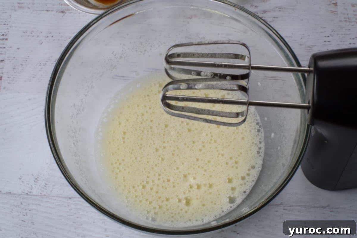 Eggs beaten until fluffy in a large mixing bowl