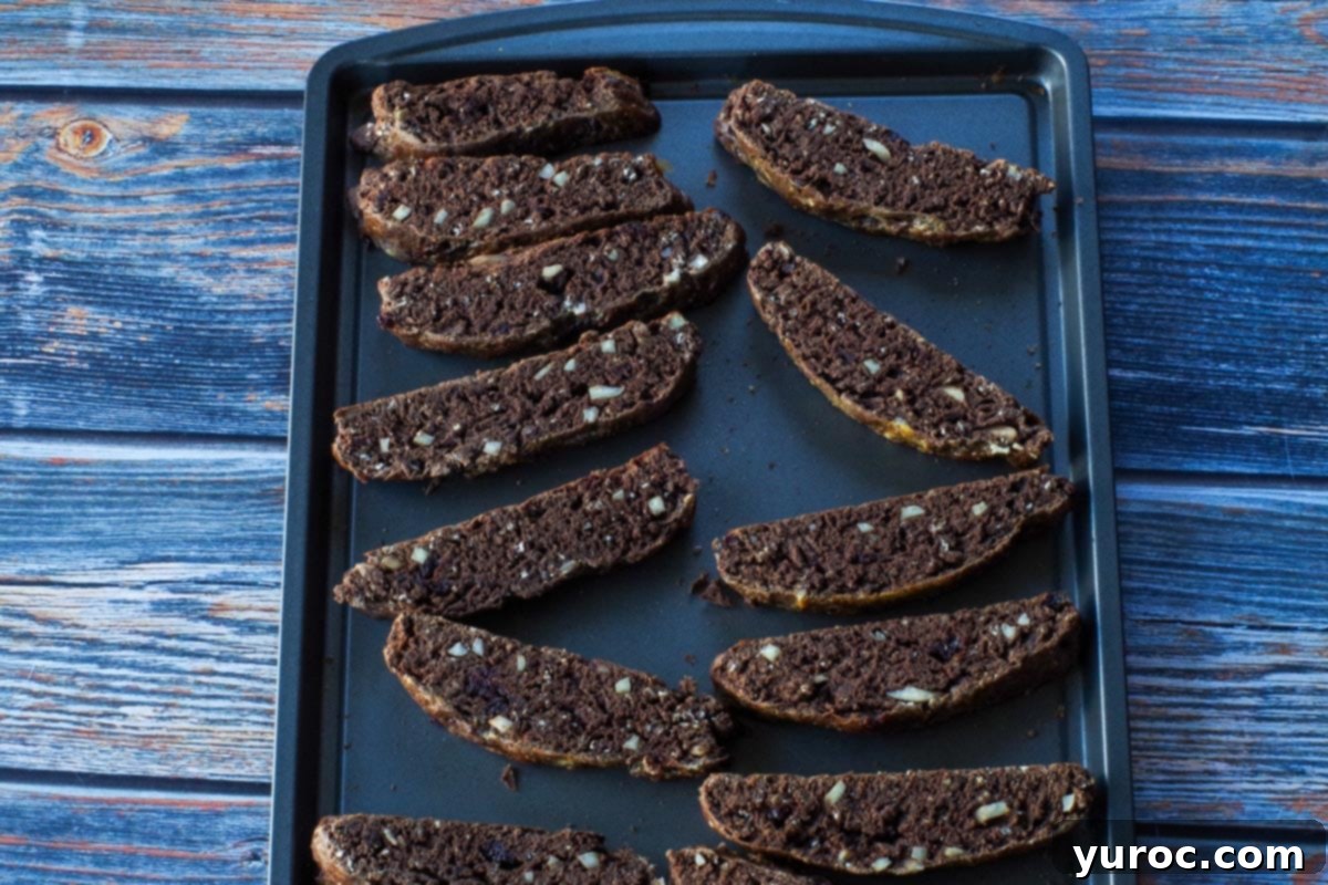 cut biscotti on cookie sheet