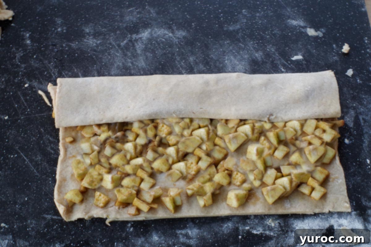 dough folded over first ⅓ of apple mixture