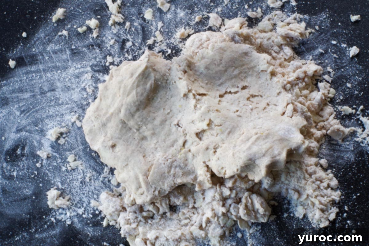 dough with loose flour on cutting board
