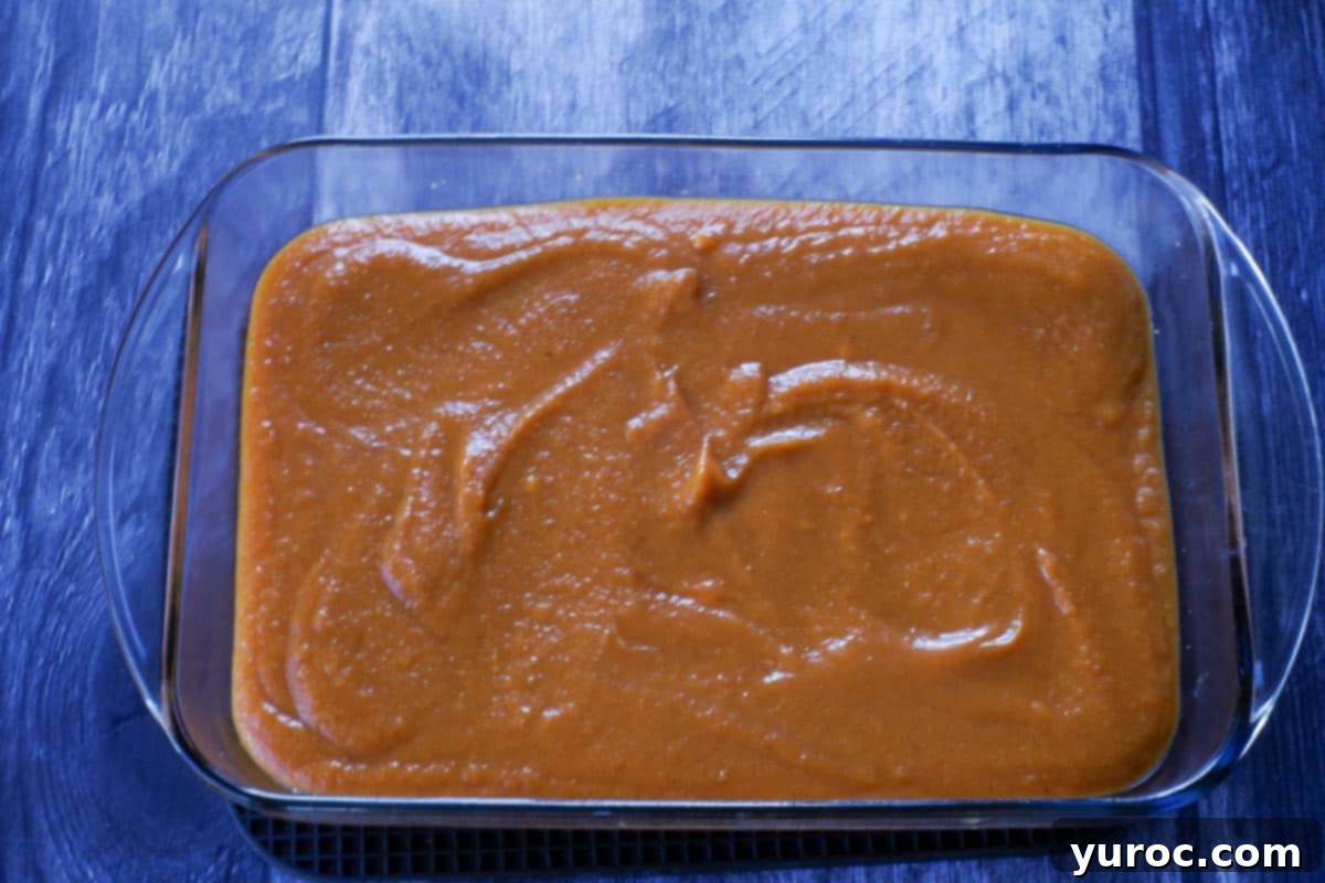 Effortless Pumpkin Perfection 11 The pumpkin mixture carefully poured over the cooled graham cracker crust in the glass 9x13 inch pan.