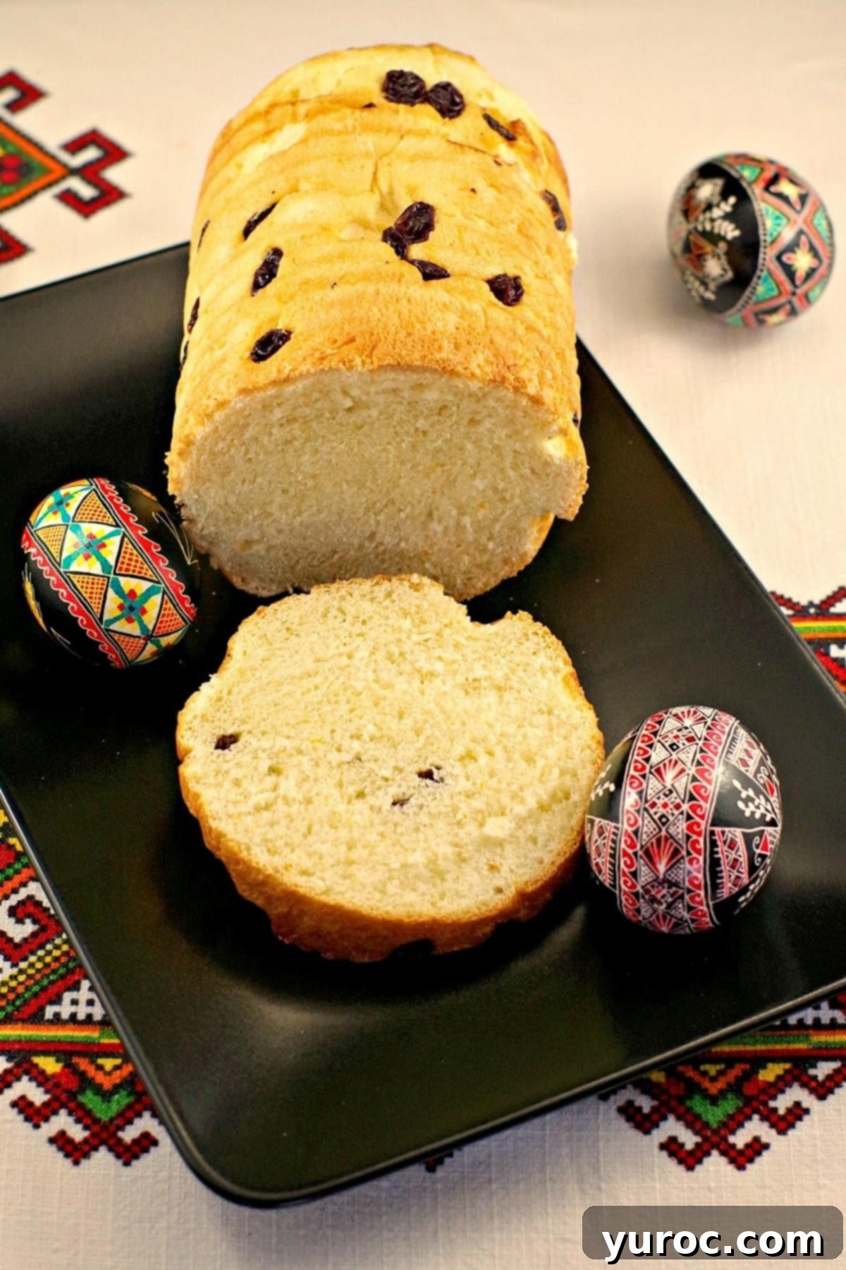 Bread Machine Ukrainian Easter Babka 5 babka Ukrainian Easter bread on a black platter with Ukrainian Easter eggs around it