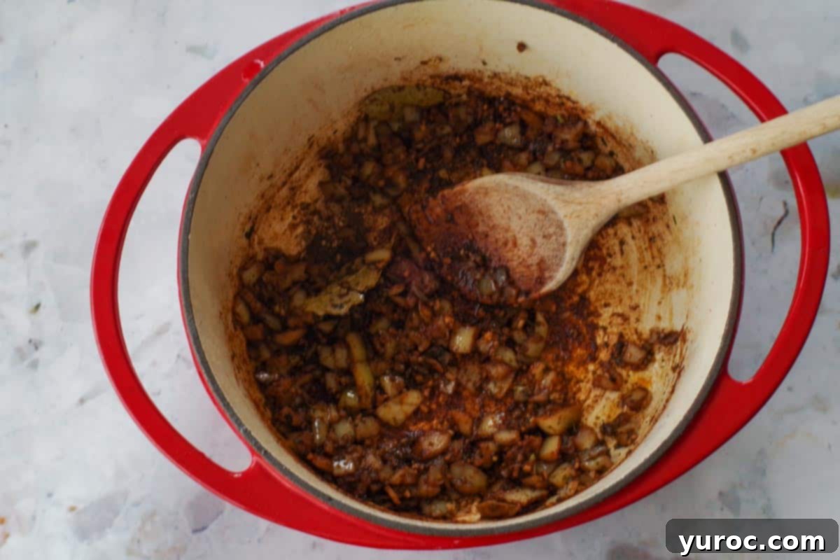 Onions mixed with spices until softened.