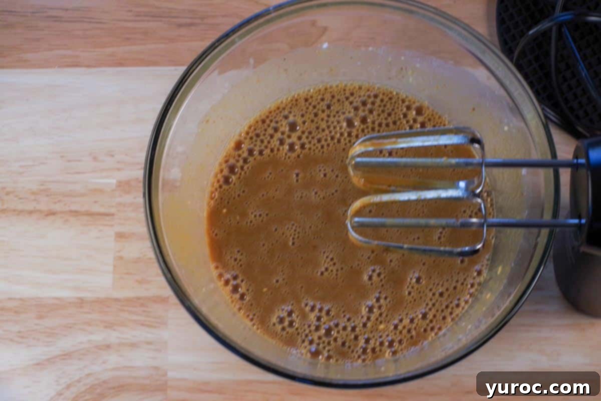 Prize-Winning Canned Pumpkin Pie 6 All the pumpkin pie ingredients, expertly beaten together in a large glass bowl, with electric mixer beaters poised above, ready for the next step.